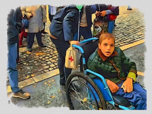 A Ukranian boy in a wheelchair, associated with The TOUCH Project Rehab Center.